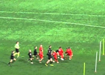 Kids playing Aussie Rules Football