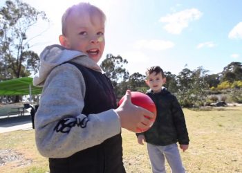 Jace and Jordan doing AUSSIE RULES FOOTBALL – The DEAs from Down Under