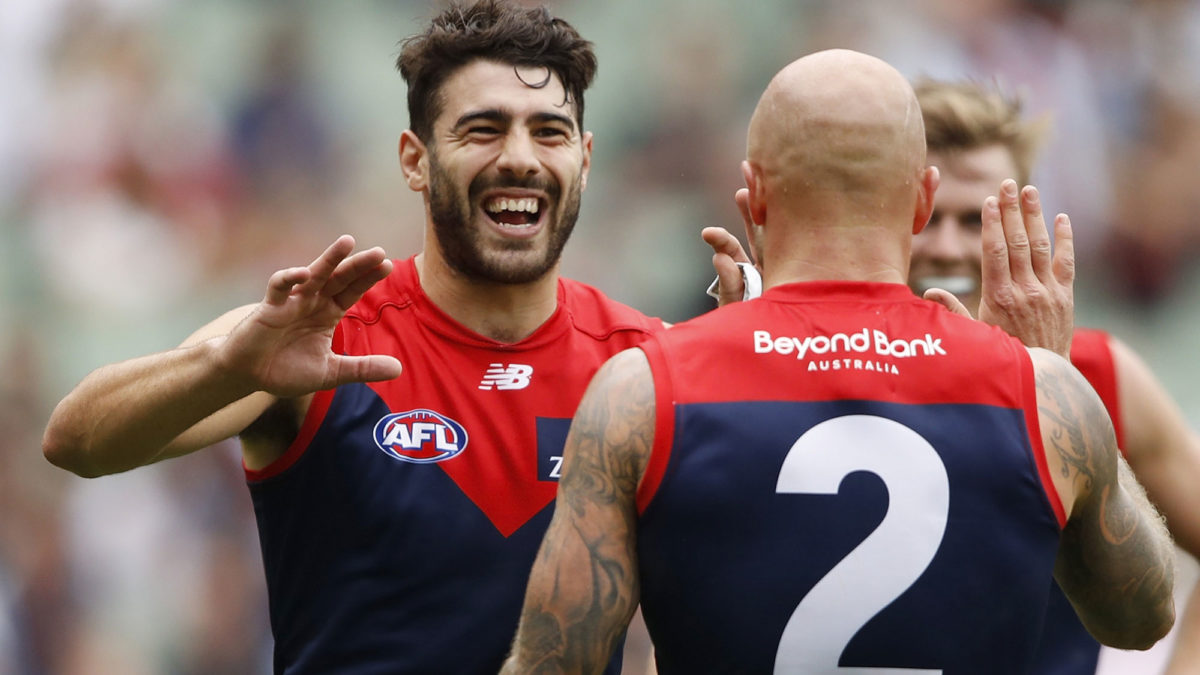 Demons win to sit atop AFL ladder