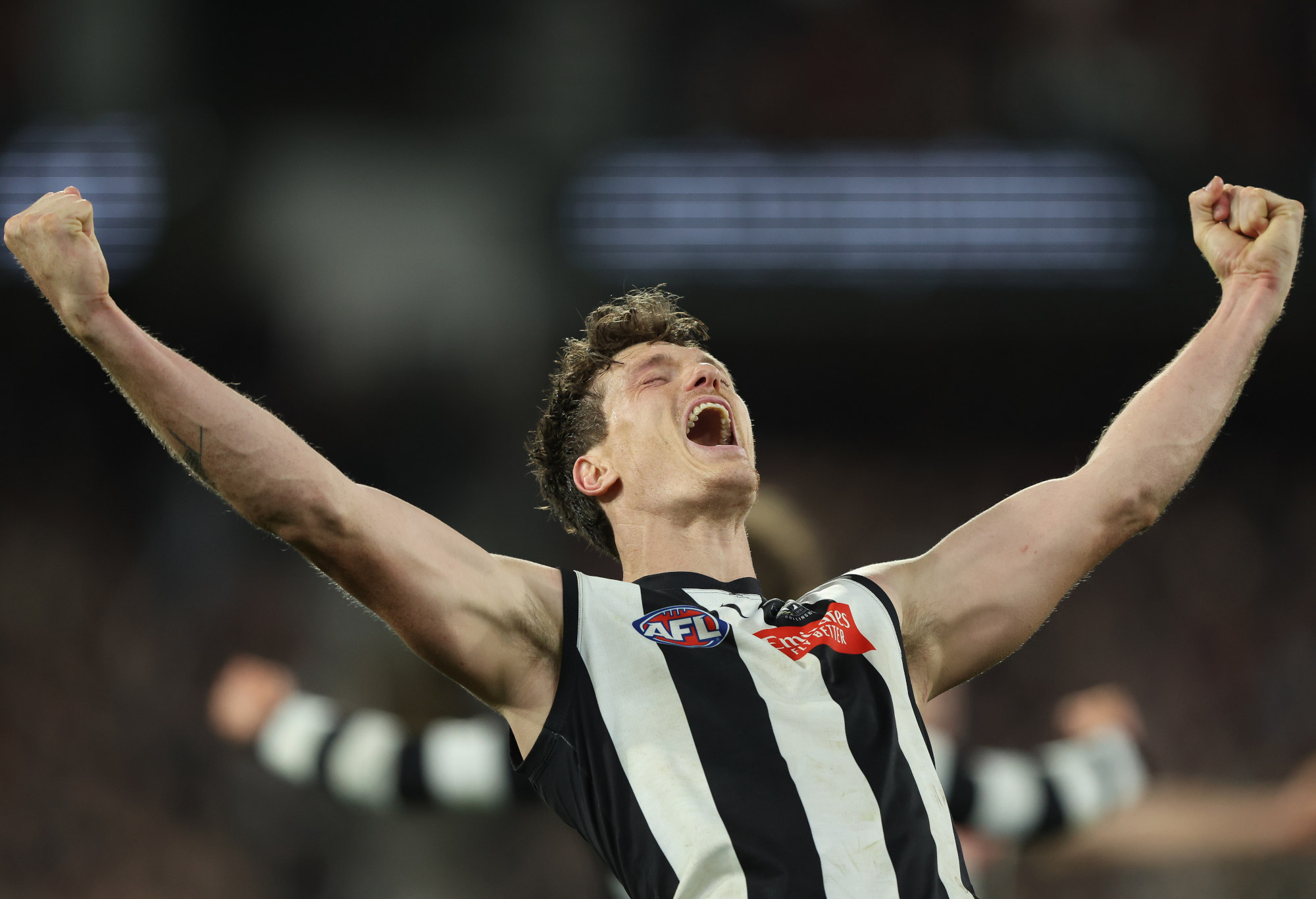 Brody Mihocek celebrates Collingwood's preliminary final win.