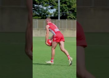 Chad Warner holding the ball and goal v GWS