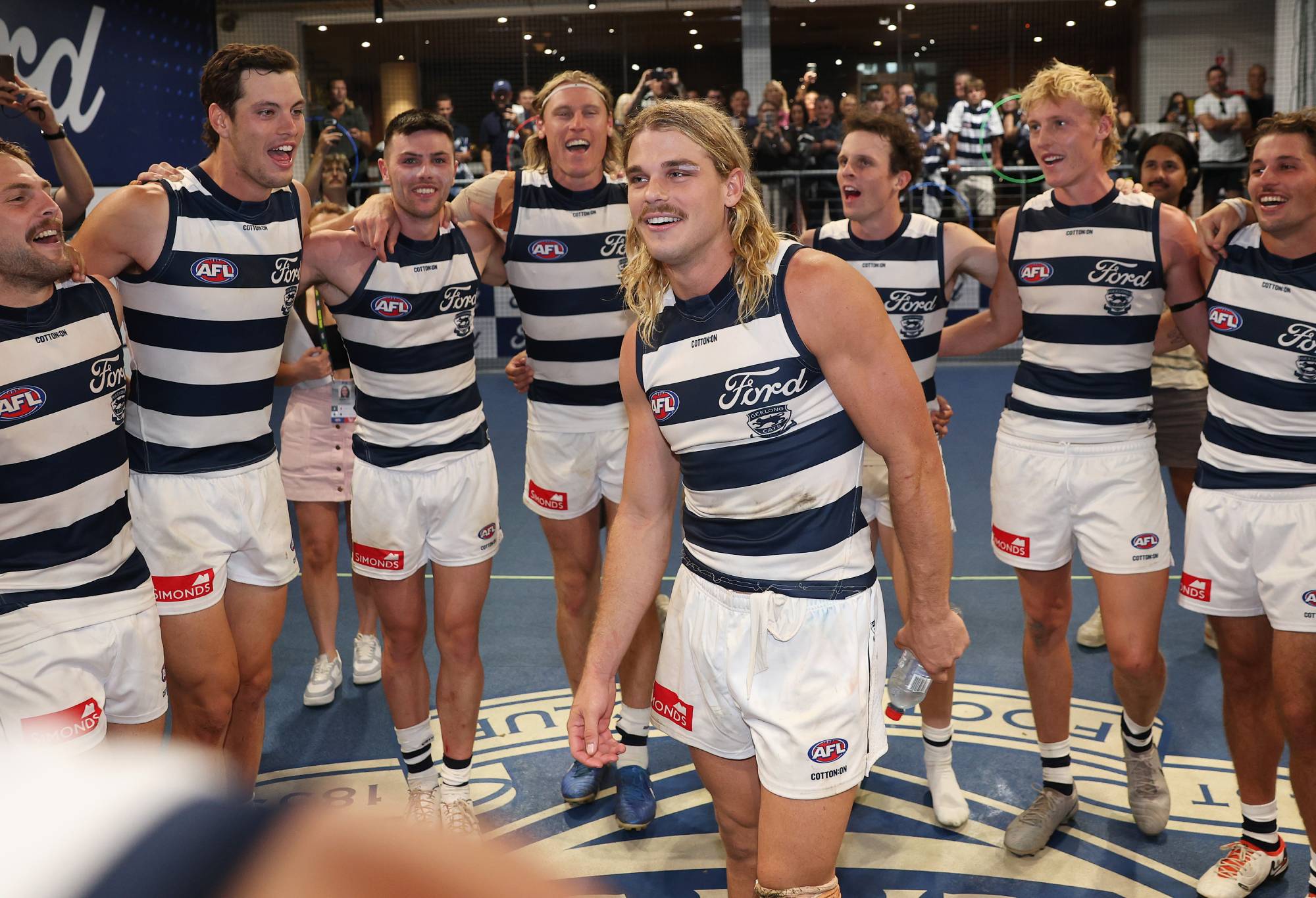 Bailey Smith of the Cats sings the team sing with teammates after winning the round one AFL match between Geelong Cats and Fremantle Dockers at GMHBA Stadium, on March 15, 2025, in Geelong, Australia. (Photo by Daniel Pockett/Getty Images)